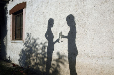 Shadow of man walking on street
