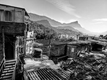 View of ruined houses against mountain