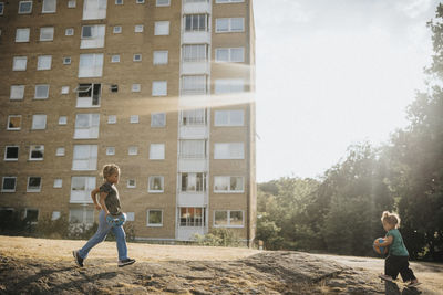 Sisters playing outdoors in residential area