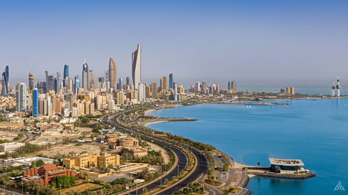 Panoramic view of buildings in city against clear sky