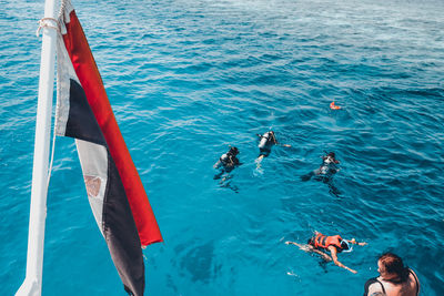 High angle view of people swimming in pool