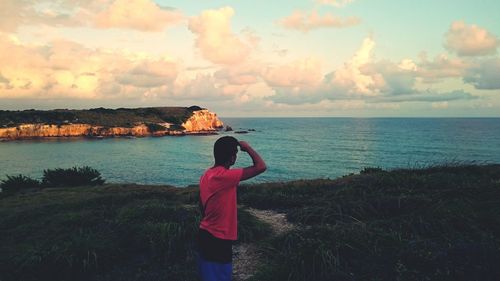 Scenic view of sea against cloudy sky