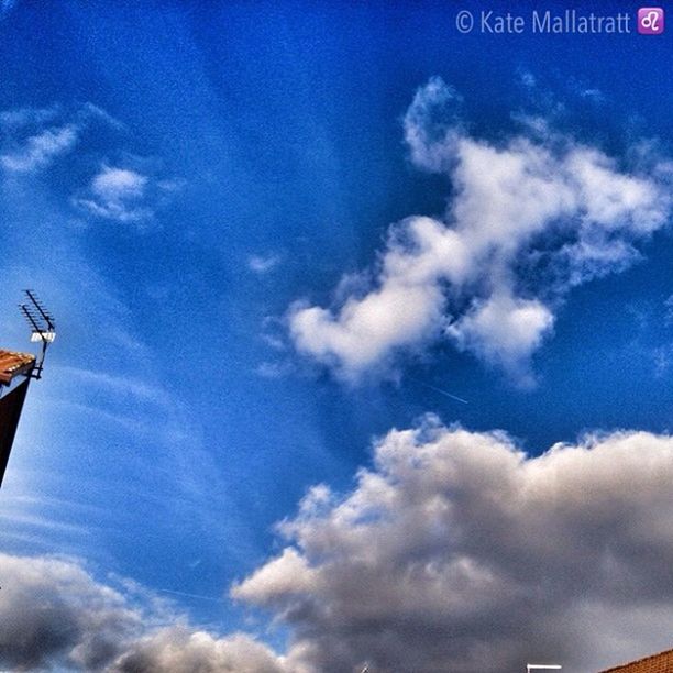 low angle view, sky, cloud - sky, blue, cloud, cloudy, nature, outdoors, day, no people, high section, beauty in nature, cloudscape, tranquility, communication, white color, vapor trail, scenics, transportation, flying