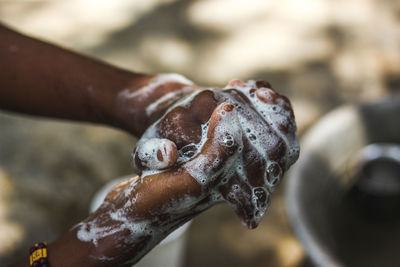 Close-up of human hand holding metal