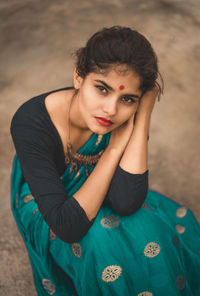 High angle portrait of beautiful woman wearing sari on field