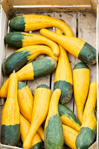 High angle view of yellow pumpkins in market