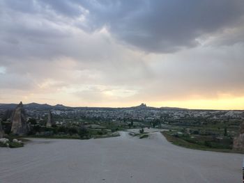 Scenic view of river against cloudy sky