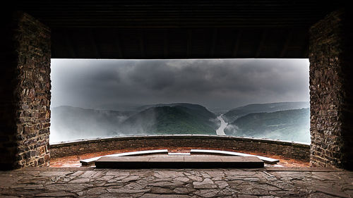 Low angle view of boat on mountain against sky