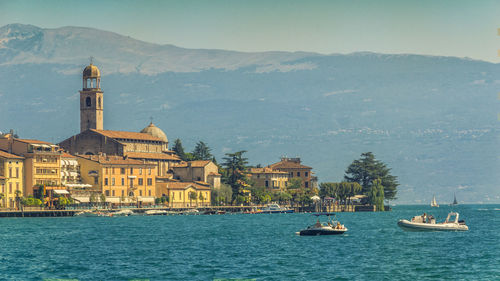 Scenic view of lake by buildings