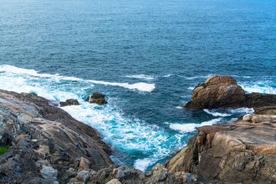 High angle view of rocks in sea