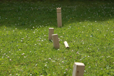 Cross on grass in field