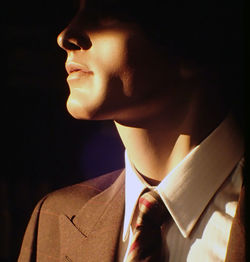 Sunlight falling on mannequin with necktie