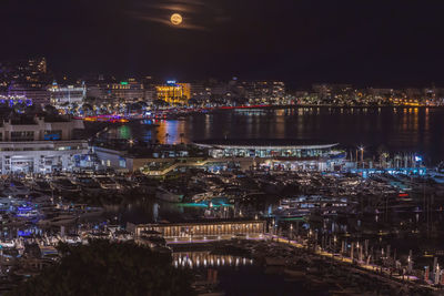 High angle view of illuminated buildings in city at night