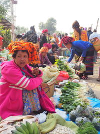 People at market stall