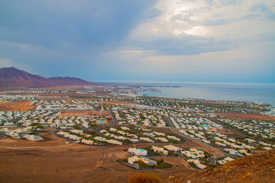 High angle view of sea shore against sky