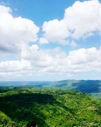 Scenic view of landscape against cloudy sky