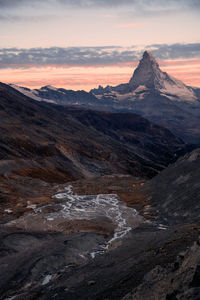 Scenic view of mountains against sky during sunset