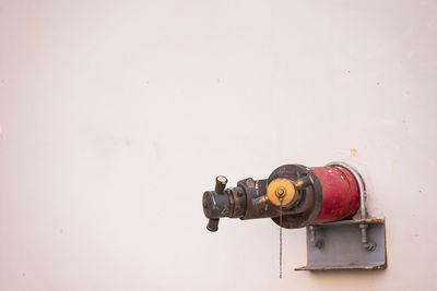 Close-up of fire hydrant against white background