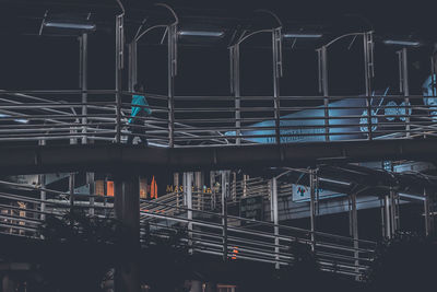 Low angle view of footbridge at night