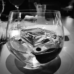 Close-up of wine glasses on table