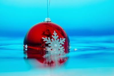 Close-up of water against blue background