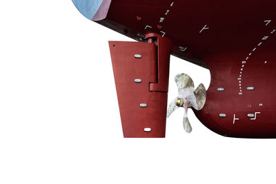 Low angle view of female sculpture against white background