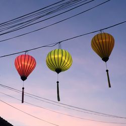 Low angle view of lantern against clear sky during sunset