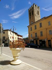 Street amidst buildings against sky