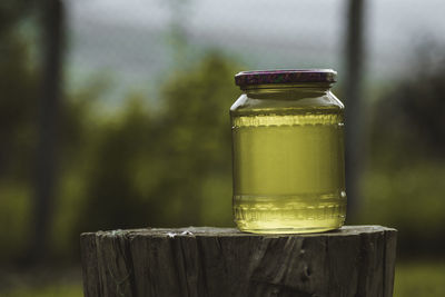 Close-up of glass jar on wooden table