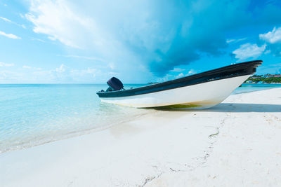 Boat on the beach in san andres island at the caribbean, colombia, south america