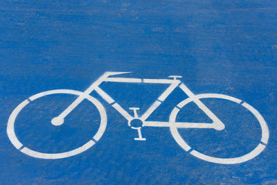 High angle view of bicycle sign on street