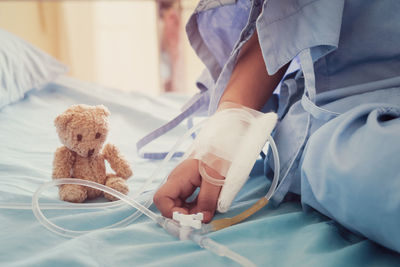 Midsection of baby girl with toy