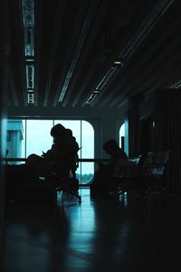 Silhouette people working at airport