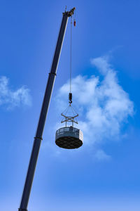 Low angle view of communications tower against sky