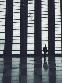 Full length of woman standing on wall