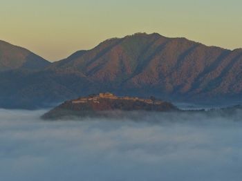 Scenic view of mountains against sky during sunset