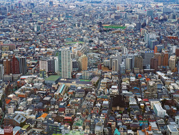 High angle view of cityscape against cloudy sky