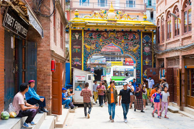 People walking on street in city