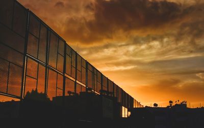 View of city against sky during sunset