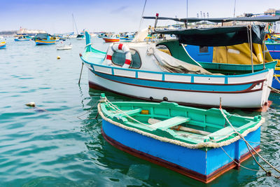 Boats moored in sea