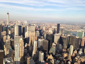 Aerial view of modern buildings in city against sky