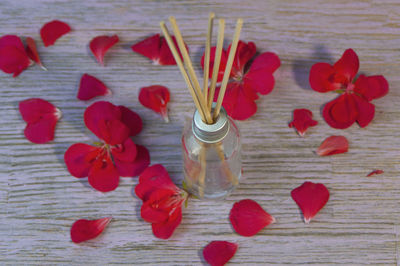 High angle view of red flowers on table