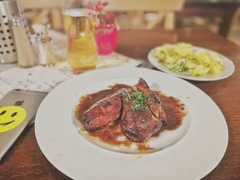 Close-up of food served on table