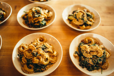 High angle view of food served in bowls on table