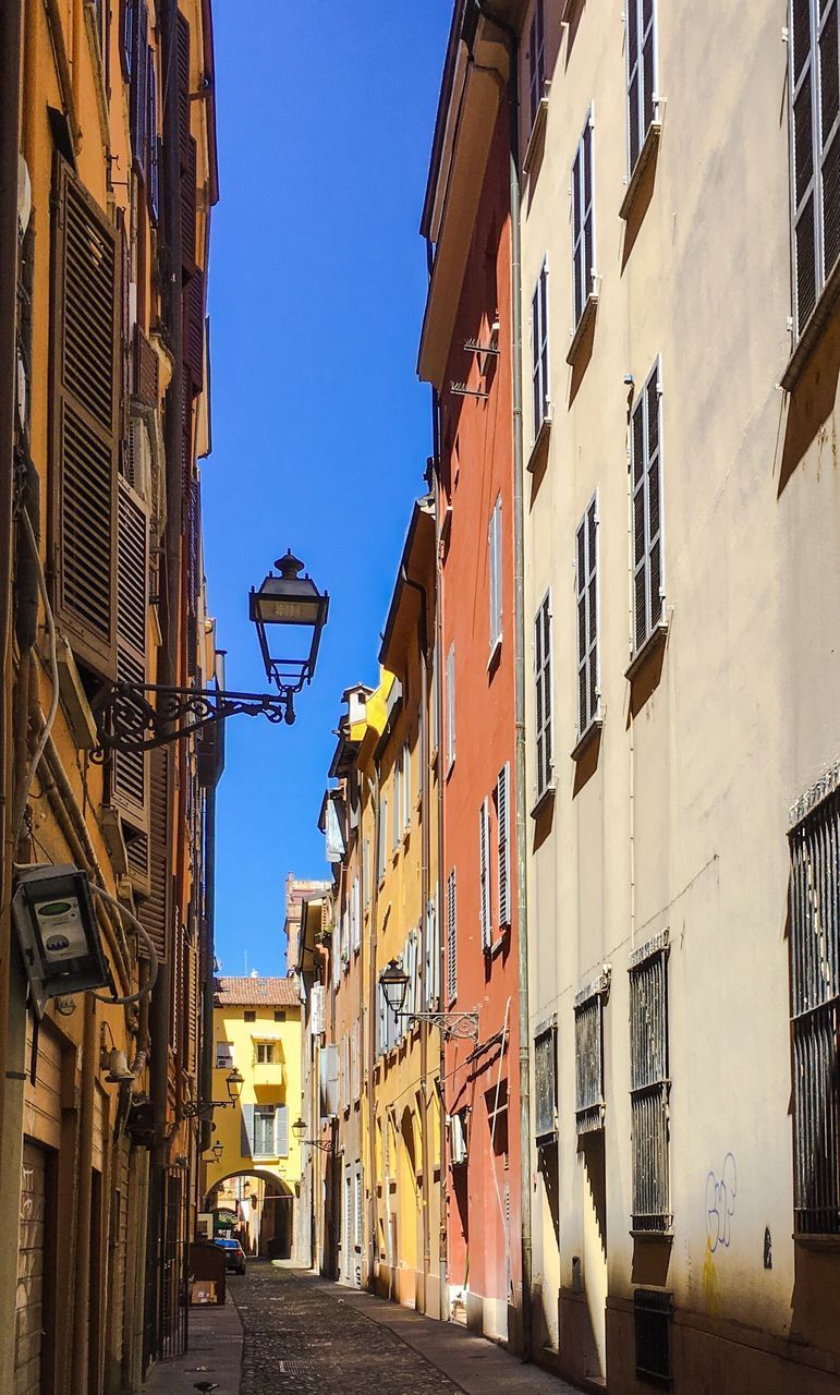 STREET AMIDST BUILDINGS IN TOWN