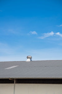 Low angle view of building against clear blue sky