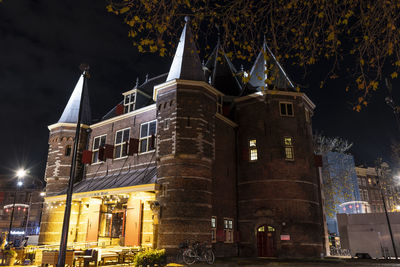 Low angle view of illuminated building at night