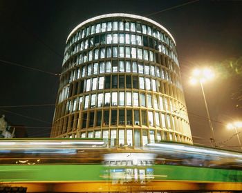 Illuminated modern office building at night