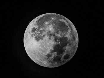 Low angle view of moon against clear sky at night