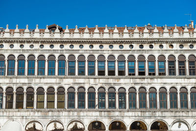 Low angle view of building against blue sky